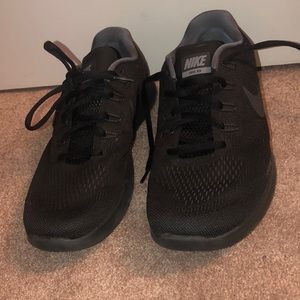 All black Nike free runs
